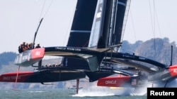 Oracle Team USA's AC72 catamarans train near Golden Gate Bridge, San Francisco Bay, California, Aug. 21, 2013.