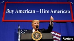 FILE - U.S. President Donald Trump speaks before signing an executive order directing federal agencies to recommend changes to a temporary visa program used to bring foreign workers to the United States to fill high-skilled jobs during a visit to the world headquarters of Snap-On Inc, a tool manufacturer, in Kenosha, Wisconsin, April 18, 2017.