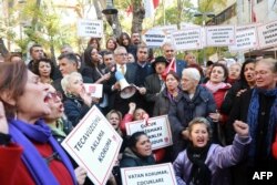 FILE - Turkish women stage a protest in Ankara on Nov. 19, 2016 after a government legislation proposal that would overturn men's convictions for child sex assault if they married their victim.