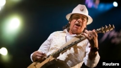 FILE - Mexican guitarist Carlos Santana performs onstage during the 45th Montreux Jazz Festival in Montreux July 2, 2011.