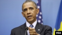 President Barack Obama gestures during his joint news conference with Swedish Prime Minister Fredrik Reinfeldt, Sept. 4, 2013, at the Rosenbad Building in Stockholm, Sweden.