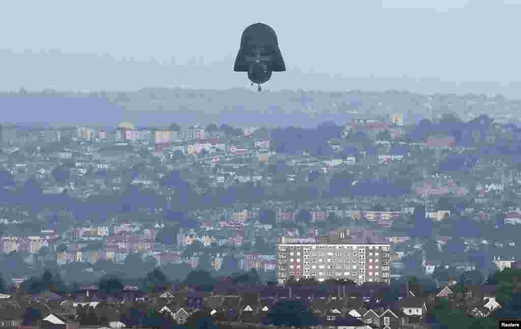 A balloon shaped as the head of Star Wars film character Darth Vader is seen flying at the yearly Bristol hot air balloon festival in Bristol, Britain.