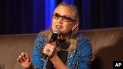 Carrie Fisher speaks during Wizard World Chicago Comic-Con at the Donald E. Stephens Convention Center in Chicago, Aug. 21, 2016.