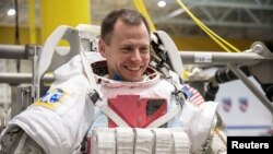 FILE - Astronaut Nick Hague trains at the NASA Neutral Buoyancy Laboratory (Sonny Carter Training Facility) in Houston, Texas, Dec. 7, 2017.