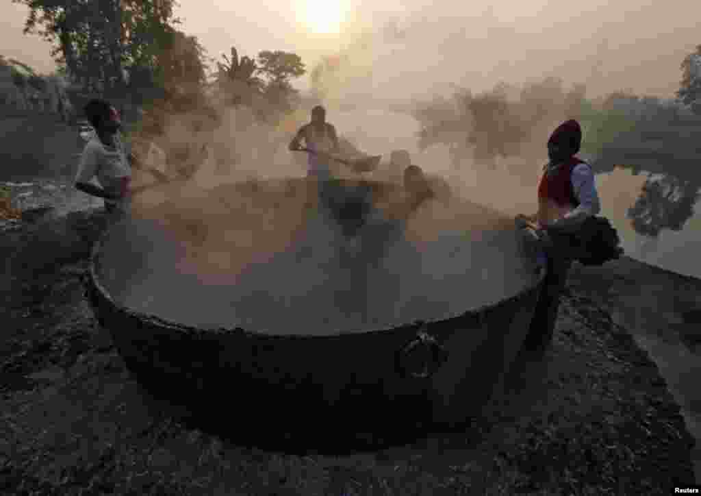 Laborers make fertilizer ingredients out of scrap leather at a roadside factory in Kolkata, India.