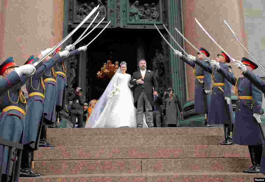 Grand Duke George Mikhailovich Romanov and Victoria Romanovna Bettarini leave St. Isaac&#39;s Cathedral after their wedding ceremony in Saint Petersburg, Russia.