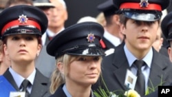 British fire services personnel prepare to lay a wreath during a memorial service at St Paul's Catherdral in London on September 11, 2011 to commemorate the tenth anniversary of the terrorist attacks against the US.