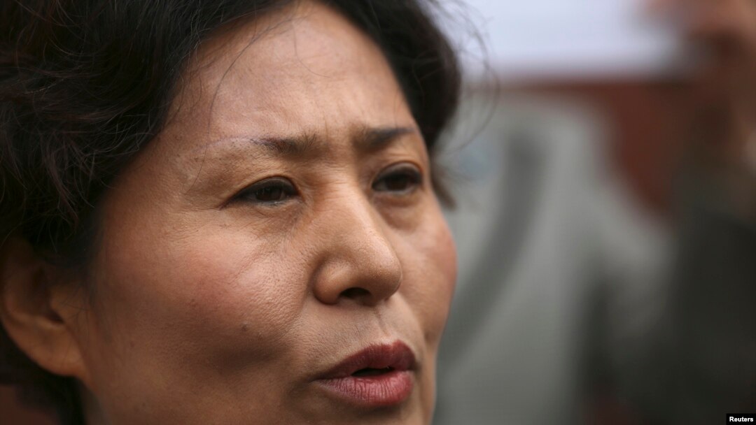 Geng He, wife of Gao Zhisheng, speaks at a news conference at the Chinese Consulate in San Francisco, California, August 7, 2014.