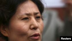 Geng He, wife of Gao Zhisheng, speaks at a news conference at the Chinese Consulate in San Francisco, California, August 7, 2014.