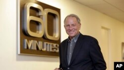 FILE - "60 Minutes" executive producer Jeff Fager poses for a photo at the "60 Minutes" offices, in New York, Sept. 12, 2017. 