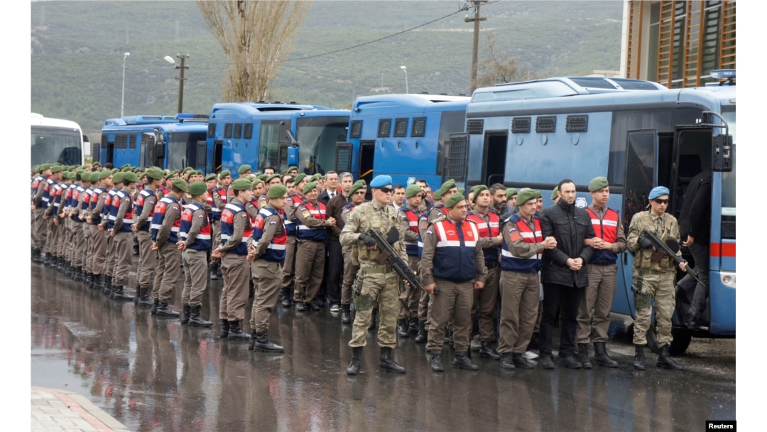 Turkish soldiers accused of attempting to assassinate President Tayyip Erdogan on the night of the failed July 15 coup, are escorted by gendarmes as they arrive at the court in Mugla, Turkey, March 8, 2017.
