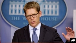 White House press secretary Jay Carney gestures during his daily news briefing where he spoke about the budget and partial government shutdown, at the White House in Washington, Oct. 11, 2013.
