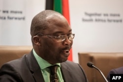 FILE - South Africa's minister of justice and correctional services, Michael Masutha, speaks to the press in Pretoria, South Africa, Oct. 21, 2016.