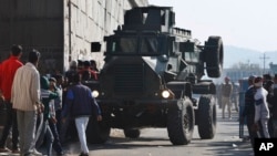 An Indian armored vehicle moves near an Indian air force base in Pathankot, 430 kilometers (267 miles) north of New Delhi, India, Jan. 2, 2016. Gunmen attacked the air force base near the border with Pakistan early Saturday.