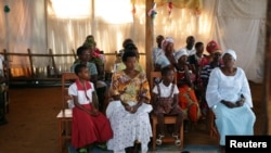 Worshipers attend Sunday service in Bujumbura, Burundi, July 19, 2015.