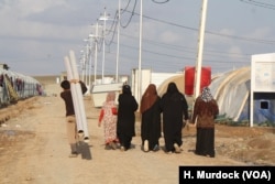 Wives of captured or killed IS fighters say they had no capacity to stop their husbands from joining the group in their conservative society, pictured on Feb. 28, 2018 in Haj Ali, Iraq.