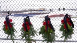 Memorial wreaths are shown at Oxford High School in Oxford, Mich., Dec. 1, 2021.