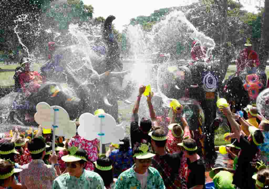 Elephants spray tourists with water in Thailand's Ayutthaya province, during Songkran, the water festival that marks the start of Thailand's traditional New Year. (Reuters)
