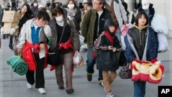 Djeca evakuirana iz blizine elektrane Fukushima, u ožujku 2011.