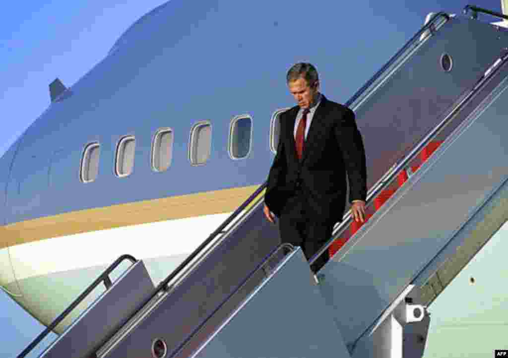 President Bush walks down the steps of Air Force One as he arrives at Andrews Air Force Base, Md., Tuesday, Sept. 11, 2001. (AP Photo/Doug Mills)