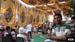 Fifteen-year-old Abdulrahman Usama has been staying in this tent for nearly a month and says he won't go back to school until the former president is reinstated. (Heather Murdock for VOA)