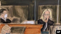 In this courtroom sketch Eva Andersson Dubin, right, testifies as Judge Alison Nathan, left, listens on the bench during the Ghislaine Maxwell's sex trafficking trial, Friday, Dec. 17, 2021, in New York. (Elizabeth Williams via AP)