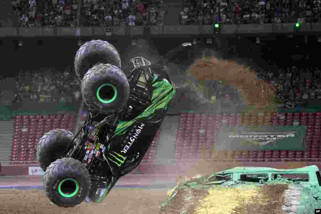 A Monster Jam truck performs a back flip during the first-ever monster truck event in Beijing&#39;s iconic &quot;Bird&#39;s Nest&quot; National Stadium, China, July 29, 2017.