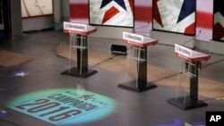 The podiums are ready for Saturday night's Democratic presidential debate between Sen. Bernie Sanders, former Secretary of State Hillary Clinton and former Maryland Gov. Martin O'Malley, in Des Moines, Iowa, Nov. 13, 2015.