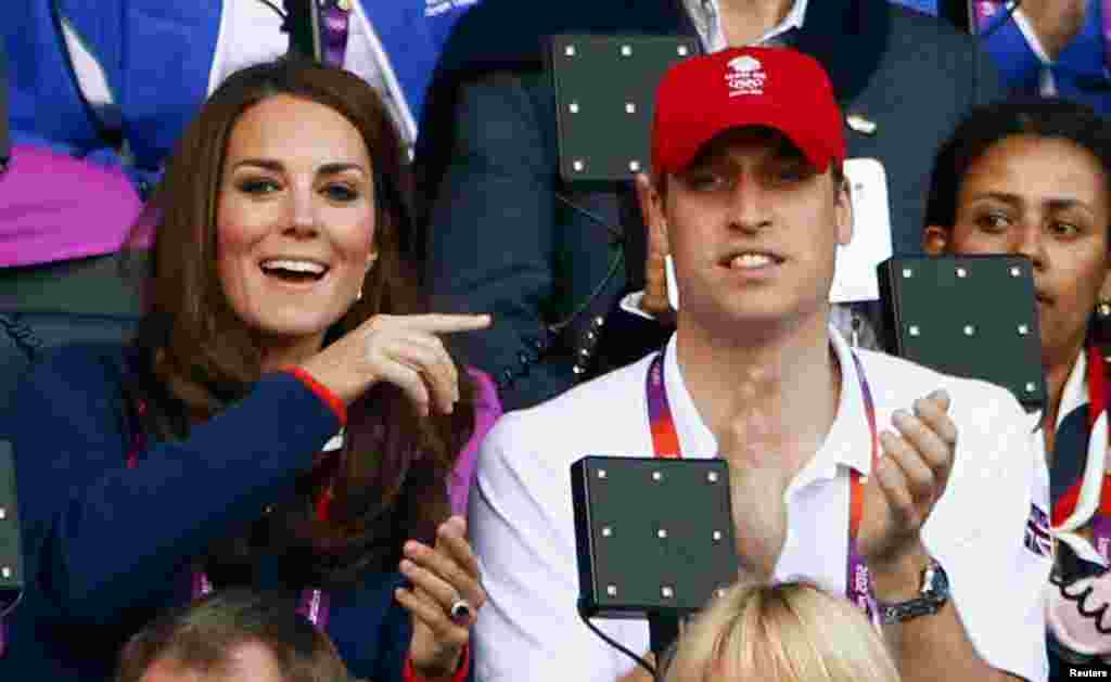 Britain's Prince William and his wife Catherine, Duchess of Cambridge, are seen at the Olympic Stadium during the London 2012 Olympic Games August 4, 2012.