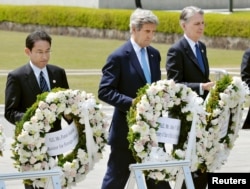 U.S. Secretary of State John Kerry (2nd L) prepares to lay a wreath at the cenotaph with Japan's Foreign Minister Fumio Kishida (L), Britain's Foreign Minister Philip Hammond and other fellow G7 foreign ministers at Hiroshima Peace Memorial Park and Museum.