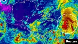 La tormenta tropical Rafael se mueve sobre el mar Caribe, en esta foto tomada el 13 de octubre,k por la NASA. Hoy podría convertirse en huracán.
