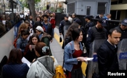 People wait in line to submit their personal appeals to the High Electoral Board for annulment of the referendum, in Ankara, Turkey, April 18, 2017.