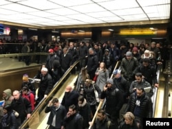 Commuters exit the New York Port Authority in New York City, U.S. Dec. 11, 2017 after reports of an explosion.