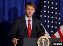 Consumer Financial Protection Bureau Director Richard Cordray speaks in Washington, Oct. 17, 2014.