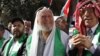 Jordanian Islamic Action Front secretary general Hamza Mansour, center, joined about 15,000 marchers demanding constitutional reforms during in Amman on Oct. 5, 2012. (AP)