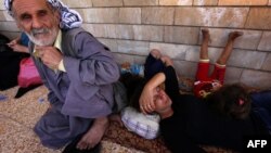 Iraqi Christians who fled the violence in the village of Qaraqush. 