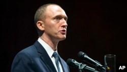 FILE - In this July 8, 2016, photo, Carter Page, then adviser to U.S. Republican presidential candidate Donald Trump, speaks at the graduation ceremony for the New Economic School in Moscow, Russia.