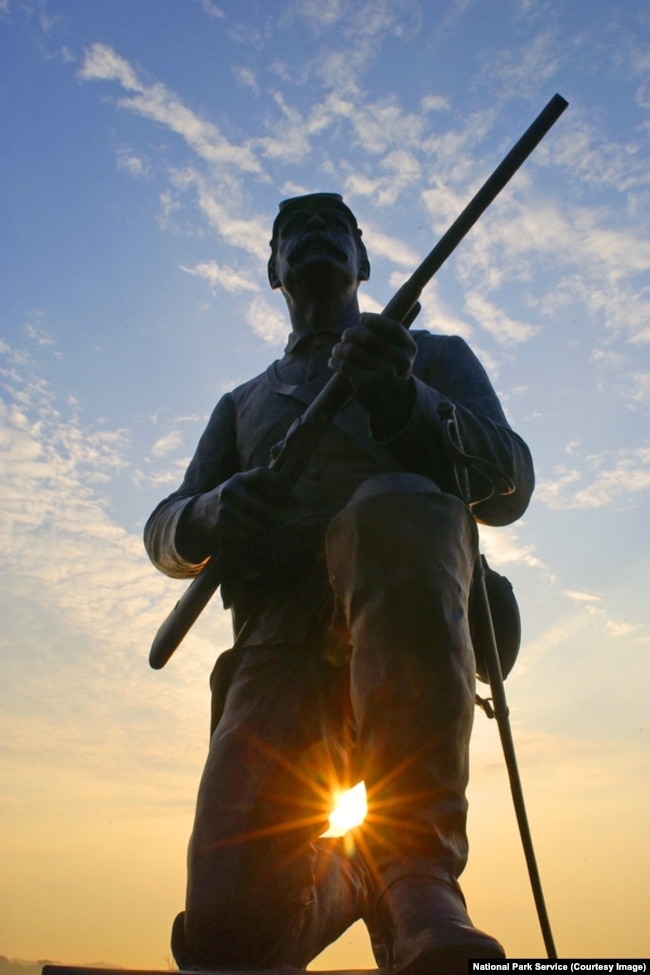 The bronze likeness of a Union trooper, carbine at the ready, sits atop the monument to the 1st Pennsylvania Cavalry.