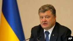FILE - Ukrainian President Petro Poroshenko speaks during the expanded board of the Ministry of Internal Affairs in Kyiv, July 10, 2015. 