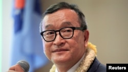 FILE - Cambodian opposition leader Sam Rainsy delivers a speech to members of the Cambodia National Rescue Party (CNRP) at a hotel in metro Manila, Philippines, June 29, 2016.