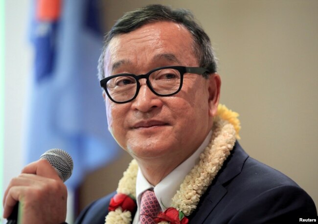 FILE - Cambodian opposition leader Sam Rainsy delivers a speech to members of the Cambodia National Rescue Party (CNRP) at a hotel in metro Manila, Philippines, June 29, 2016.