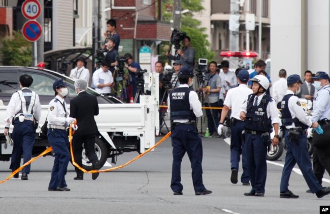 Police officers work at the scene where a man wielding a knife attacked a group of schoolchildren in Kawasaki, near TokyoMay 28, 2019.