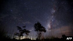 FILE - This long-exposure photograph shows the Milky Way in the clear night sky near Yangon, Aug. 12, 2013.