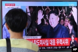 A man watches a TV news program showing an image of N. Korean leader Kim Jong un during the North's latest test launch of an intercontinental ballistic missile, at Seoul Railway Station in Seoul, S. Korea, July 29, 2017.