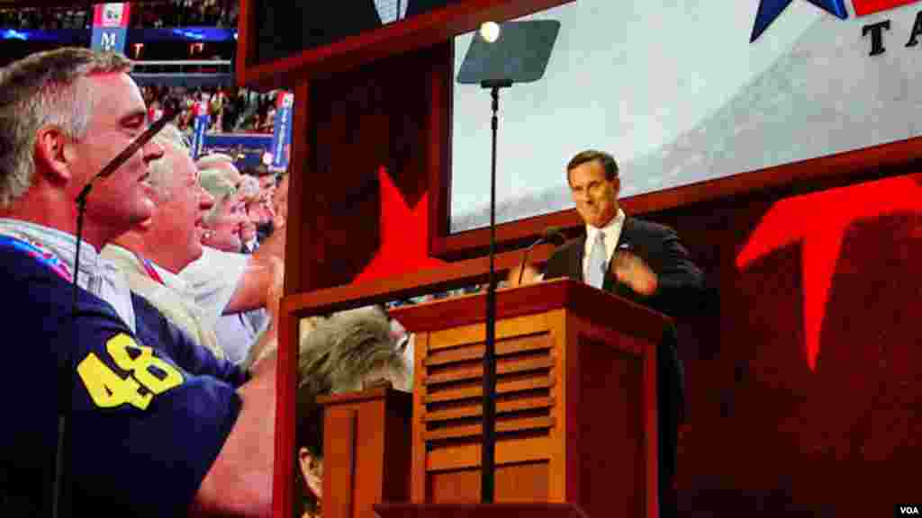 Former candidate for the Republican Presidential nomination, Rick Santorum, shows his support for his party and Mitt Romney during his speech.