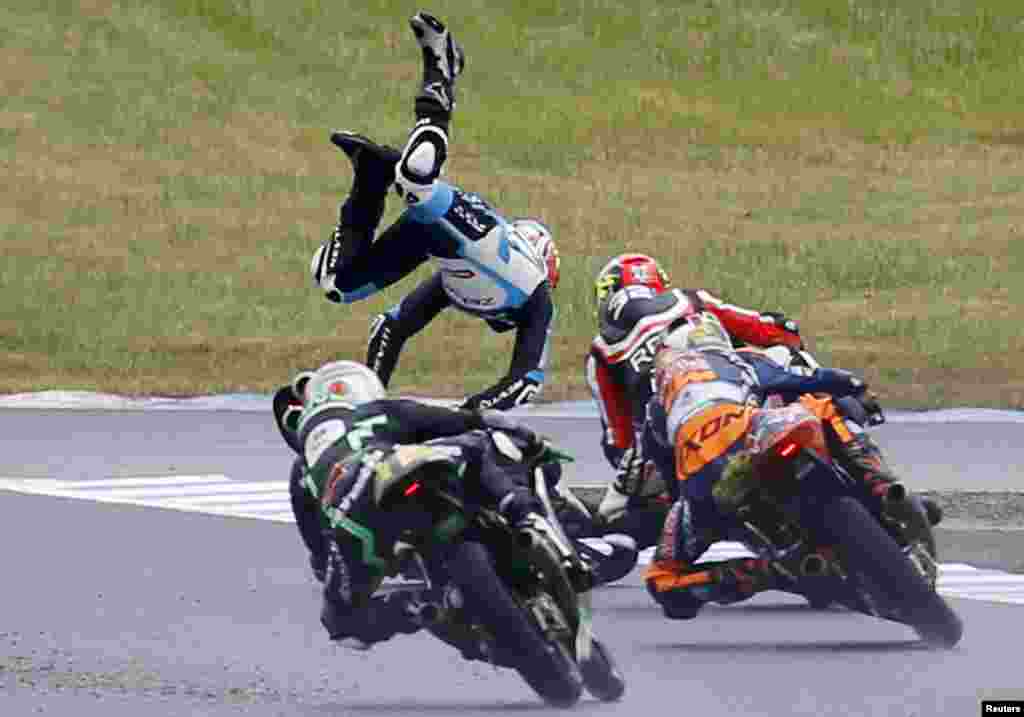 Honda Moto3 rider Livio Loi of Belgium falls during the Japanese Grand Prix at the Twin Ring Motegi circuit in Motegi, north of Tokyo.