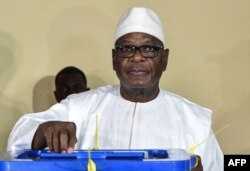 FILE - Mali's incumbent president, Ibrahim Boubacar Keita, votes in Bamako in the runoff election Aug. 12, 2018.