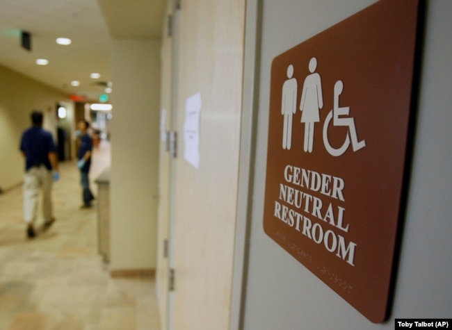 In this August 23, 2007, file photo, a sign marks the entrance to a gender-neutral restroom at the University of Vermont in Burlington, Vermont.