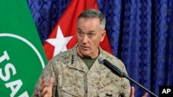 Top U.S. military commander in Afghanistan, Joseph Dunford, talks to media representatives at the ISAF headquarters in Kabul, June, 18, 2013. 