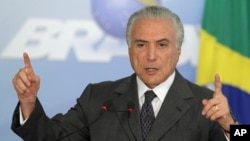  President Michel Temer speaks during a ceremony at the Planalto Presidential Palace, in Brasilia, Brazil, Dec. 13, 2016. Earlier Tuesday, Brazil's Congress passed a measure to cap government spending over the next 20 years.